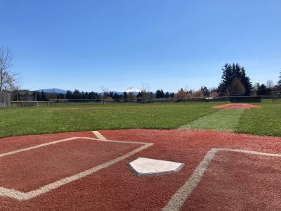 Little League baseball field at Columbia Park. Home plate in the foreground, view of Mt. Hood in the distance.