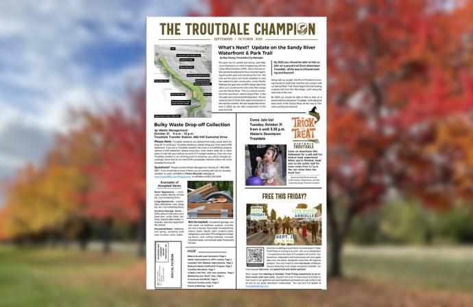 Troutdale Champion September-Ocotber 2023 edition. Blurred image of trees with fall colors in background